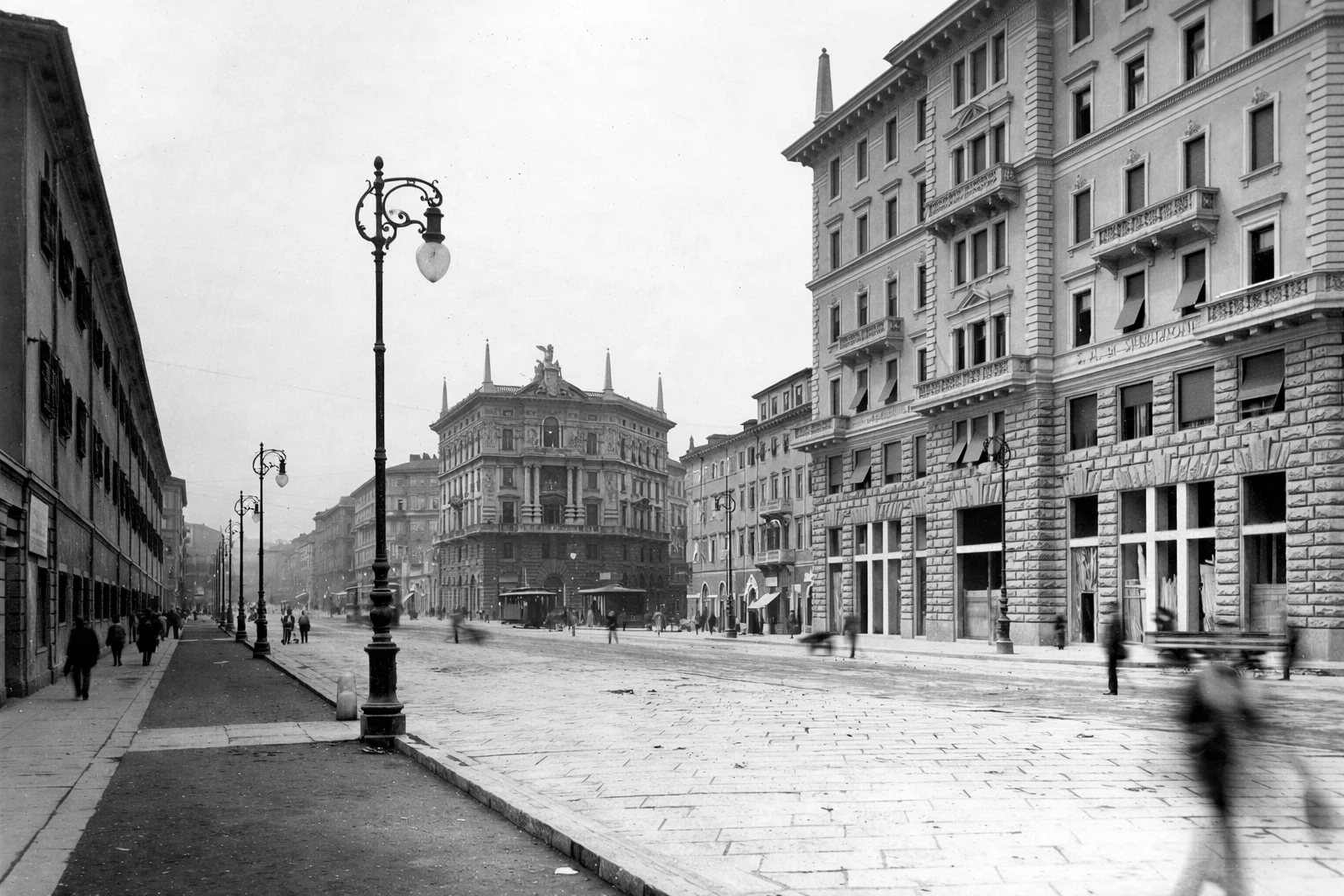 Via Carducci with Saima Palace under construction and Caserma Grande